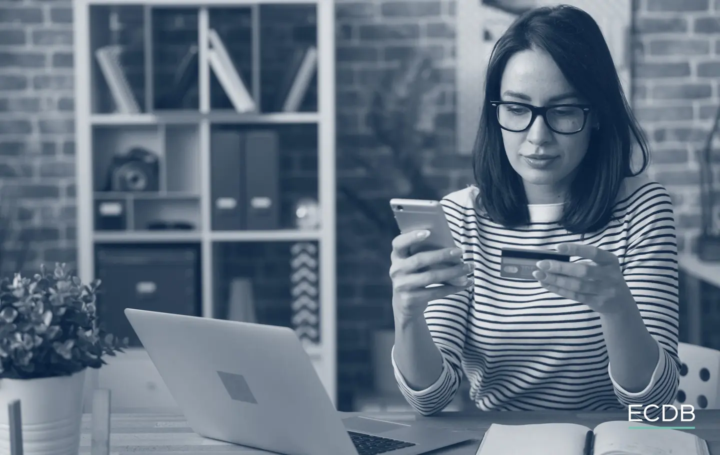 woman with a phone card laptop